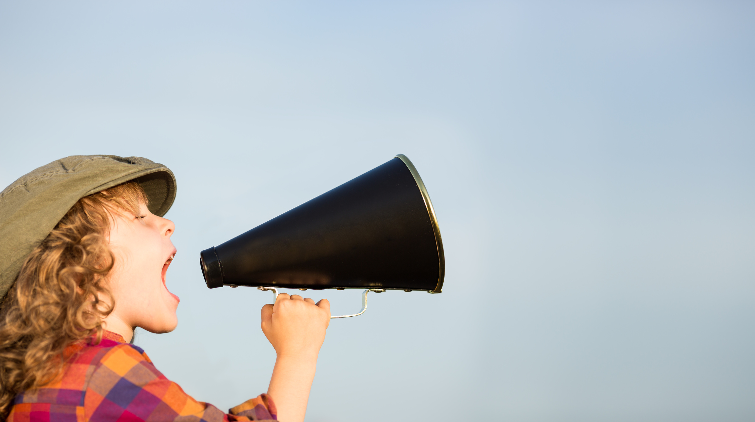 Kid shouting through megaphone Kid shouting through megaphone